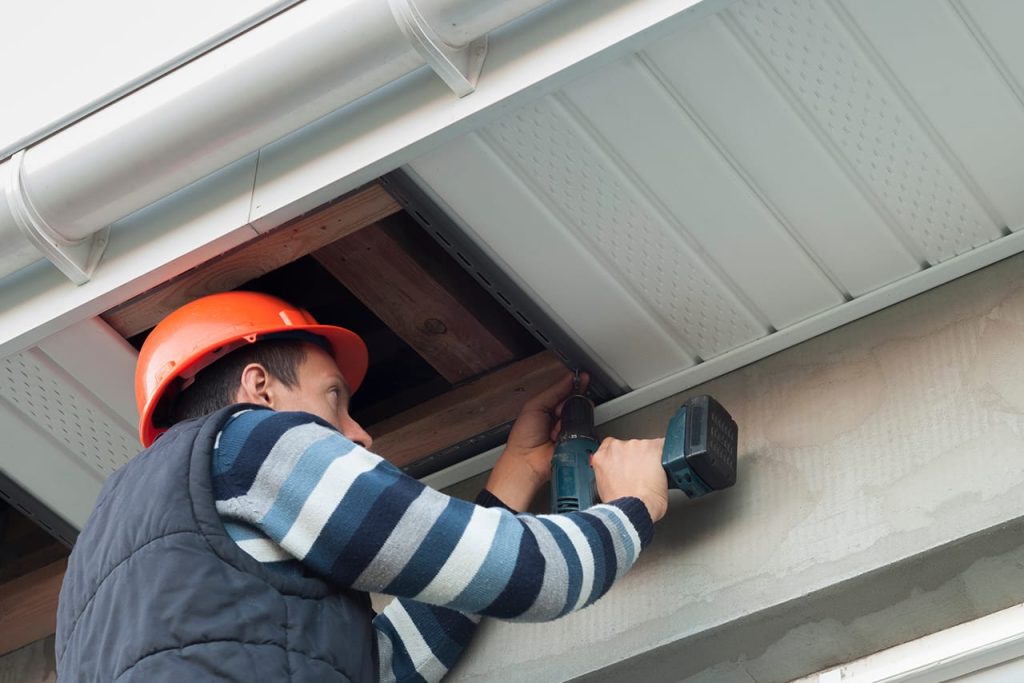 expert installer installing a new fascia and soffit 